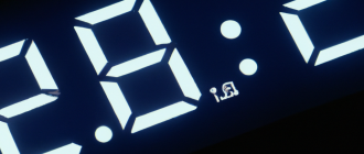 How does a digital clock display time?