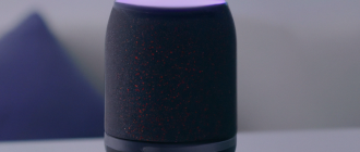 How does a smart speaker play music and answer questions?